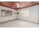 The room boasts natural light from surrounding windows and neutral carpet at 2107 N Campo Allegre Dr, Tempe, AZ 85288
