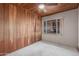 This bedroom offers a cozy atmosphere and natural light from a window at 2107 N Campo Allegre Dr, Tempe, AZ 85288