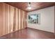 Bright bedroom featuring hardwood floors, natural light, and painted brick accent wall at 2107 N Campo Allegre Dr, Tempe, AZ 85288