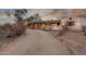 Inviting single-story home with a gravel driveway and desert landscaping at 2107 N Campo Allegre Dr, Tempe, AZ 85288