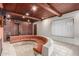 Living room with sunken seating area and wood paneled wall at 2107 N Campo Allegre Dr, Tempe, AZ 85288