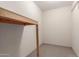 Small room with carpeted floors and exposed framing for storage buildout at 2107 N Campo Allegre Dr, Tempe, AZ 85288