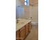 Bathroom featuring wood cabinets, newer fixtures, a shower and a toilet at 2241 E Pinchot Ave # B3, Phoenix, AZ 85016