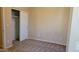 Bedroom featuring neutral walls, carpet, and a closet with sliding doors at 2241 E Pinchot Ave # B3, Phoenix, AZ 85016