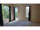 Bedroom with carpet flooring and large windows with lots of natural light at 2241 E Pinchot Ave # B3, Phoenix, AZ 85016