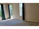 Primary bedroom has carpet flooring, and large windows providing ample natural light at 2241 E Pinchot Ave # B3, Phoenix, AZ 85016