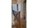 An upstairs hallway featuring a carpeted floor, wood railing, and closet at 2241 E Pinchot Ave # B3, Phoenix, AZ 85016