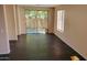 Bright living space with dark tile flooring, enhanced by natural light and direct access to the backyard at 2241 E Pinchot Ave # B3, Phoenix, AZ 85016