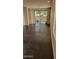 Neutral-toned living area featuring dark tile floors and sliding glass doors, leading to outdoor space at 2241 E Pinchot Ave # B3, Phoenix, AZ 85016