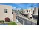 Outside view of a townhome community with palm trees, green grass, and a bright blue sky at 2241 E Pinchot Ave # B3, Phoenix, AZ 85016
