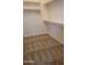 Walk-in closet provides ample space with carpet flooring and built in shelving at 2241 E Pinchot Ave # B3, Phoenix, AZ 85016