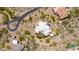 Aerial view of luxury home with white tile roof, pool and spa, desert landscaping, and winding driveway at 24548 N 121St Pl, Scottsdale, AZ 85255