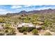 Desert landscape surrounds this home with red tile roof and mountain views at 24548 N 121St Pl, Scottsdale, AZ 85255