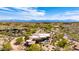 Aerial view of a luxury home, landscaped with desert flora and featuring a backyard swimming pool at 24548 N 121St Pl, Scottsdale, AZ 85255