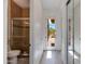 Hallway view of the bathroom featuring a walk-in shower with glass doors at 24548 N 121St Pl, Scottsdale, AZ 85255