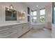 Bright bathroom featuring modern fixtures, soaking tub, and large windows at 24548 N 121St Pl, Scottsdale, AZ 85255