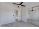 Spacious bedroom featuring a large closet with mirrored doors and white walls at 24548 N 121St Pl, Scottsdale, AZ 85255