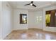 Bedroom with tiled floors, ceiling fan and multi-light windows at 24548 N 121St Pl, Scottsdale, AZ 85255