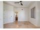 Bedroom with tiled floors, ceiling fan and bathroom view at 24548 N 121St Pl, Scottsdale, AZ 85255