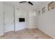 Bedroom featuring a sleek ceiling fan and a mounted flat screen television at 24548 N 121St Pl, Scottsdale, AZ 85255