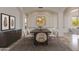 Formal dining room showcasing artwork and seating for six at 24548 N 121St Pl, Scottsdale, AZ 85255