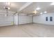 Spacious three-car garage with epoxy flooring and plenty of room for parking at 24548 N 121St Pl, Scottsdale, AZ 85255