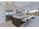 Gourmet kitchen featuring a large island with bar seating and stainless steel appliances at 24548 N 121St Pl, Scottsdale, AZ 85255