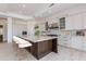 Spacious kitchen boasts ample cabinets, a large island, and stainless steel appliances for culinary enthusiasts at 24548 N 121St Pl, Scottsdale, AZ 85255