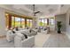 Open-concept living room with a cozy seating area, modern furnishings, and scenic mountain views at 24548 N 121St Pl, Scottsdale, AZ 85255
