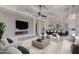 Open living space featuring a fireplace, entertainment center, and modern kitchen at 24548 N 121St Pl, Scottsdale, AZ 85255