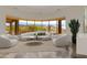 Comfortable living room with expansive windows showcasing mountain views at 24548 N 121St Pl, Scottsdale, AZ 85255
