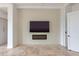 Living room with shiplap accent wall, modern fireplace, and tile flooring at 24548 N 121St Pl, Scottsdale, AZ 85255