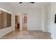 Main bedroom with tile floors and doors leading to the bathroom and closet at 24548 N 121St Pl, Scottsdale, AZ 85255