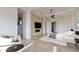 Spacious bedroom featuring a seating area, neutral tones, and access to the ensuite bathroom at 24548 N 121St Pl, Scottsdale, AZ 85255