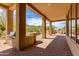Covered outdoor kitchen with built-in grill, counter space, and stunning desert views at 24548 N 121St Pl, Scottsdale, AZ 85255
