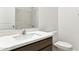 Bathroom features a modern sink with a sleek faucet, complemented by a bright white countertop and matching cabinetry at 25326 W Sunland Ave, Buckeye, AZ 85326