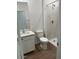 Bathroom featuring a shower with marble-style surround, modern fixtures and white sink at 25430 W Graham Trl, Buckeye, AZ 85326