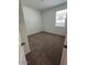 Cozy bedroom with neutral carpet and a window for natural light at 25430 W Graham Trl, Buckeye, AZ 85326