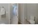 Bathroom with a toilet, towel rack, and view of the bathroom en suite at 26439 W Covey Ln, Buckeye, AZ 85396