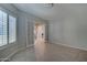 Versatile room with French doors and tile flooring, perfect for an office or guest room at 26439 W Covey Ln, Buckeye, AZ 85396
