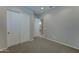 Cozy bedroom showcasing carpeted floor and a closet, perfect for organization at 26439 W Covey Ln, Buckeye, AZ 85396