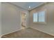 Bright bedroom featuring neutral walls, carpet, and a bathroom en suite at 26439 W Covey Ln, Buckeye, AZ 85396