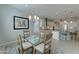 Cozy dining space adjacent to the kitchen, showcasing a glass table and elegant decor at 26439 W Covey Ln, Buckeye, AZ 85396