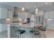 Bright kitchen with stainless steel appliances, granite countertops, and white cabinetry at 26439 W Covey Ln, Buckeye, AZ 85396