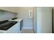Laundry room with a washer, dryer, and refrigerator, offering convenience at 26439 W Covey Ln, Buckeye, AZ 85396