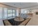 Spacious living room with tile flooring, a ceiling fan, and an open floor plan at 26439 W Covey Ln, Buckeye, AZ 85396