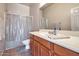 Neutral bathroom featuring a single sink vanity and a shower with a curtain at 3131 E Legacy Dr # 1104, Phoenix, AZ 85042