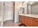 Well-lit bathroom featuring a double sink vanity and a separate walk-in shower at 3131 E Legacy Dr # 1104, Phoenix, AZ 85042