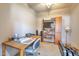A simple office space features a desk, bookshelf, and a neutral color scheme perfect for a productive work environment at 3131 E Legacy Dr # 1104, Phoenix, AZ 85042