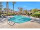 Beautiful community pool with clear blue water, palm trees, and lounge areas at 3131 E Legacy Dr # 1104, Phoenix, AZ 85042